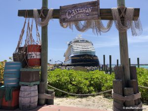 Disney Dream in the background of Castaway Cay sign