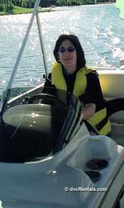 Team member Marilyn holding a fish she caught while on a boating excursion