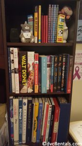 Collection of Disney books on a bookshelf