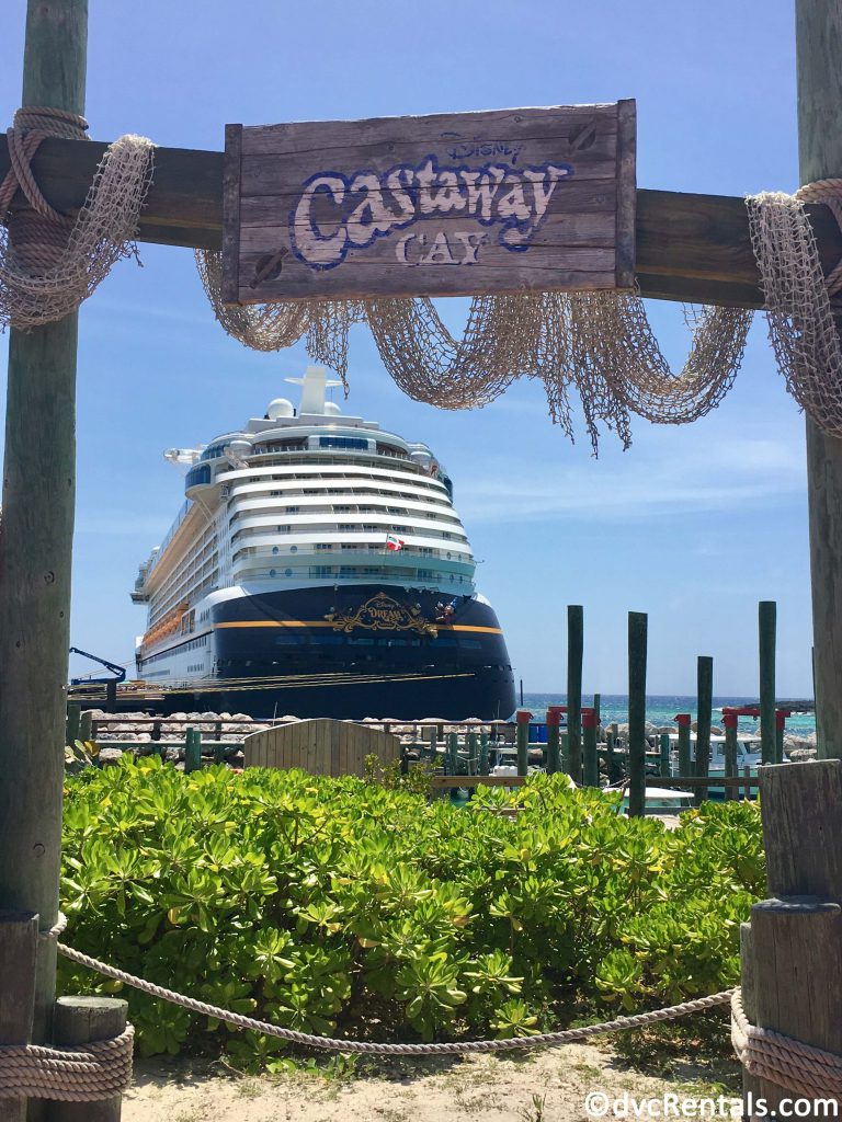 Castaway Cay sign with Disney Dream in the background