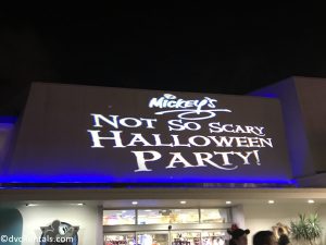 MNSSHP sign projected on the building walls at Magic Kingdom