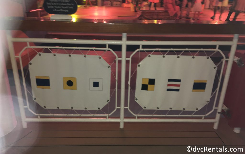 pool railing on the Disney Dream with use of nautical flags