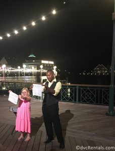 entertainer and guest performing on Disney Boardwalk