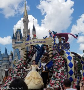 Beauty and the Beast on a float in front of Cinderella Castle