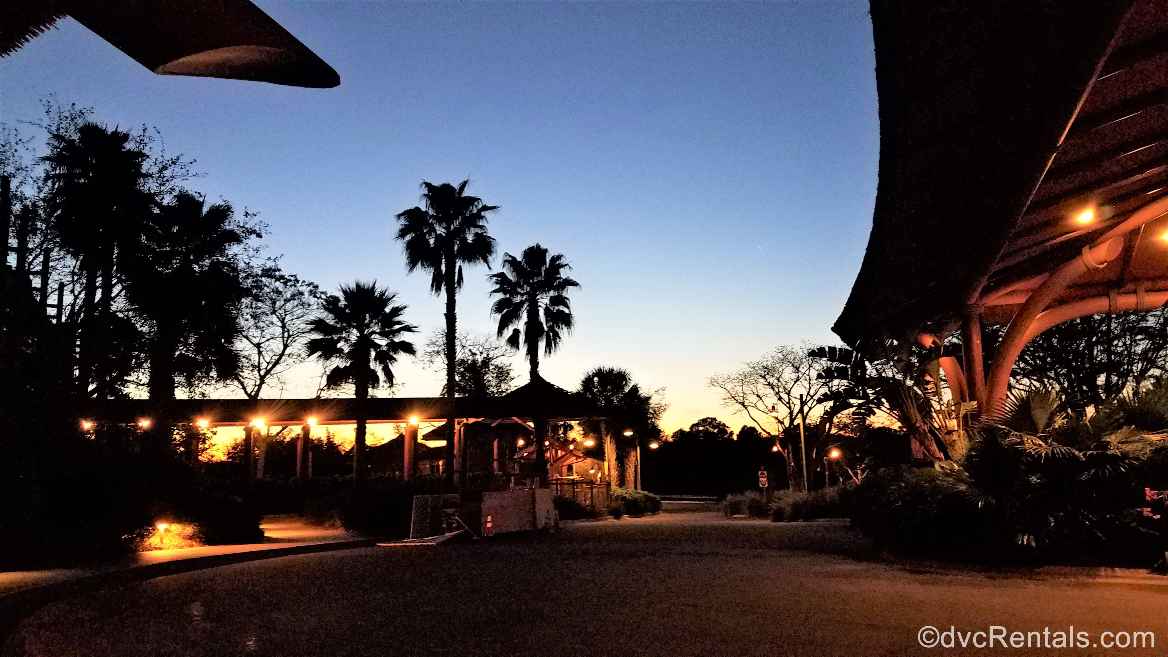 sunset over the entrance to Disney’s Animal Kingdom – Kidani Village