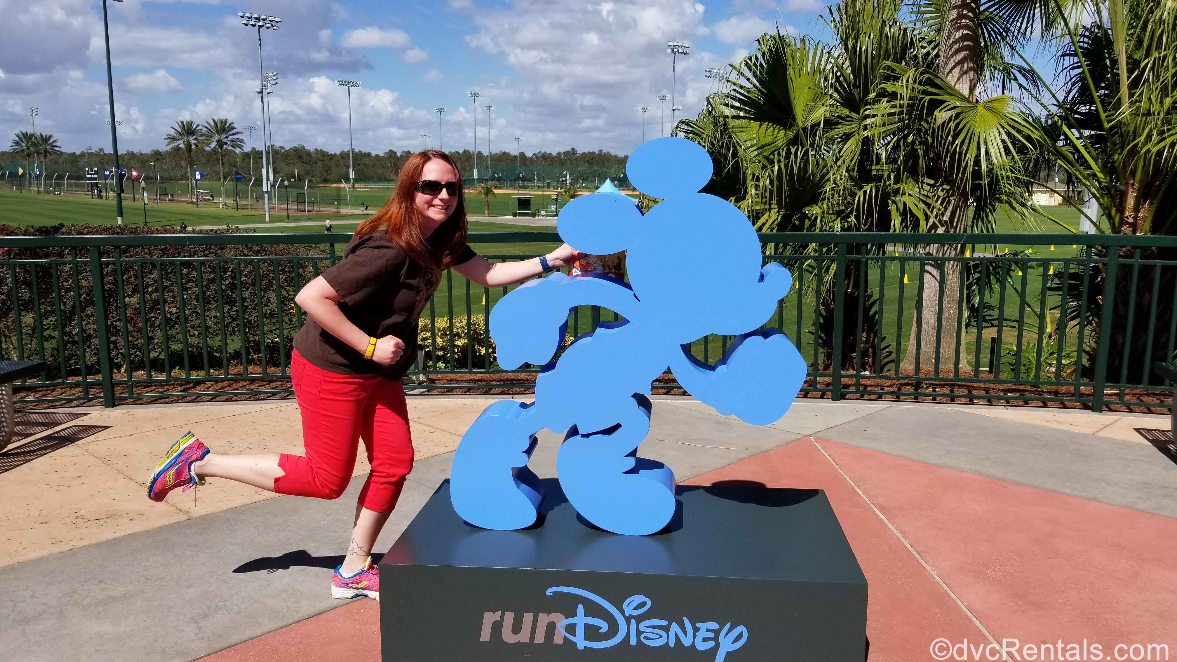 Team Member Kelly with the Run Disney Sign