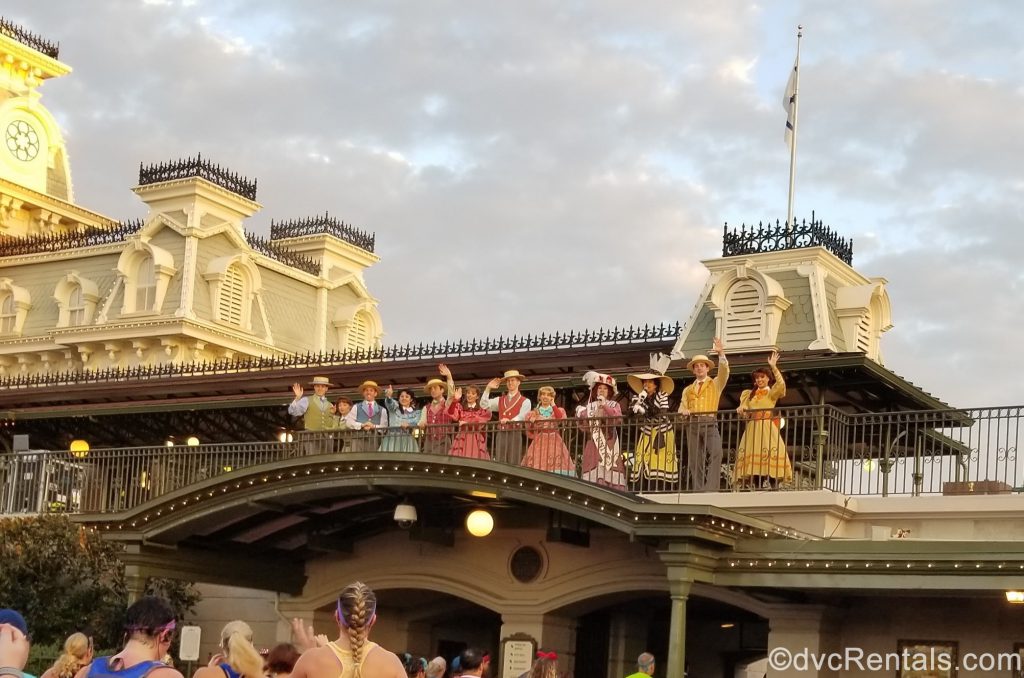 Citizens of Main Street U.S.A. greeting participants as they run through the Magic Kingdom
