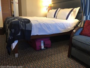 stateroom on the Disney Dream with suitcase under the bed