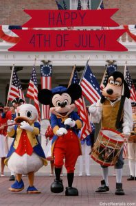 Mickey Mouse, Donald and Goofy dressed for the 4th of July