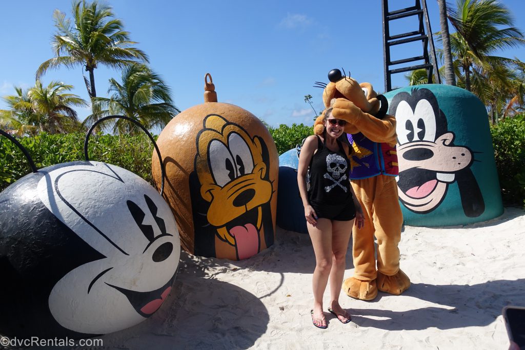 Pluto with Team Member Stephanie at Castaway Cay