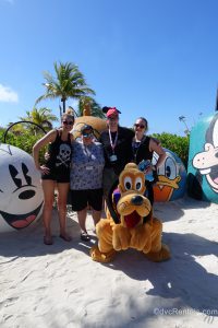 Pluto with Team Members Lindsay, Carly, Cassie and Stephanie S at Castaway Cay
