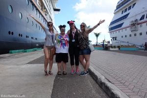 Team Members Lindsay, Carly, Stephanie S. and Cassie standing next to the Disney Dream
