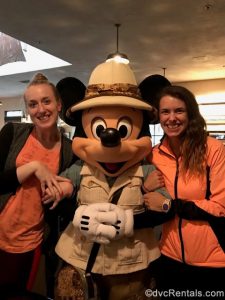 Team Members Chelsey and Stephanie S. posing for a picture with Mickey Mouse