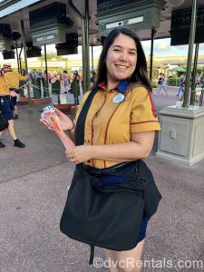 Cast Member greeting Disney After Hours guests and handing out event wristbands