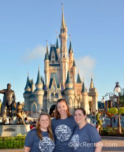 Team Member Stacy with her family in front of Cinderella Castle