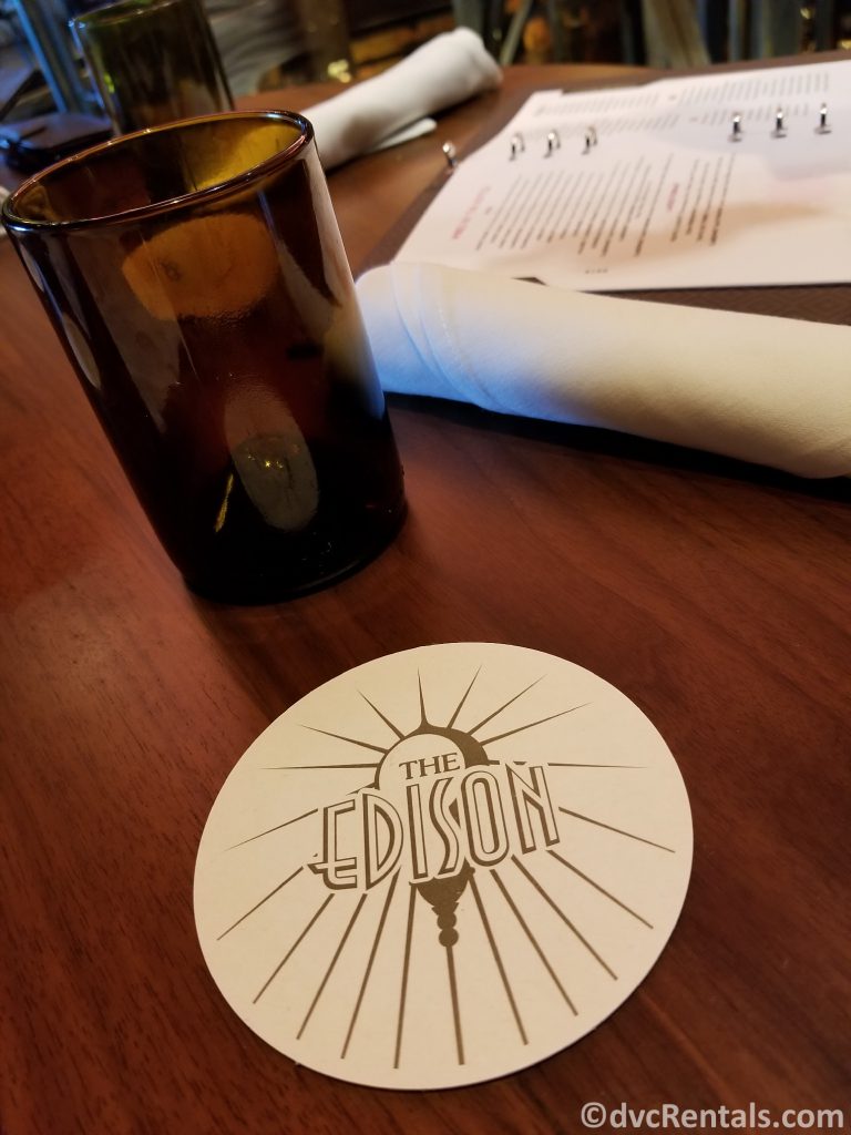 Tabletop with coaster and drink at the Edison