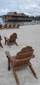 lounge chairs at the beach of Disney’s Polynesian Villas & Bungalows