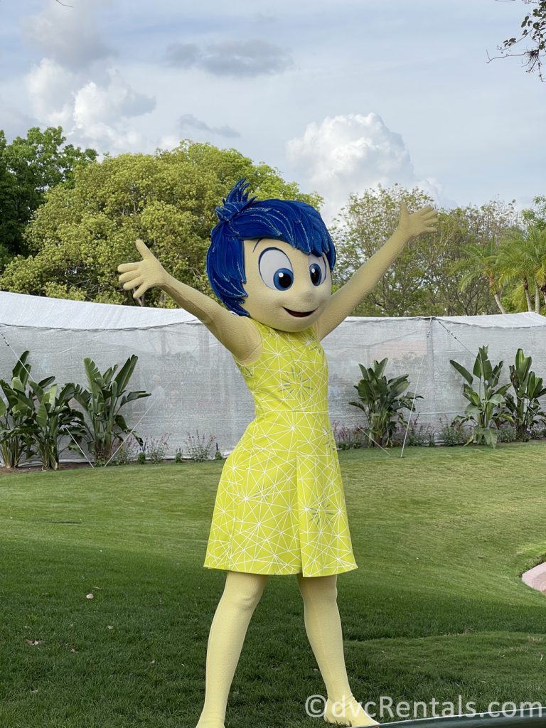 Joy from Inside Out waving to guests at Epcot