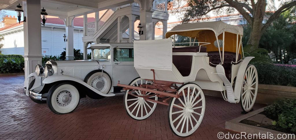 Classic car and carriage in front of the Grand Floridian Resort and Spa