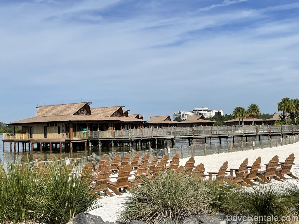 Beach with lounge chairs  at Disney’s Polynesian villas & Bungalows