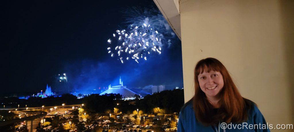 Team Member Kelly watching the Magic Kingdom Fireworks as seen from a balcony at Disney’s Bay Lake Tower
