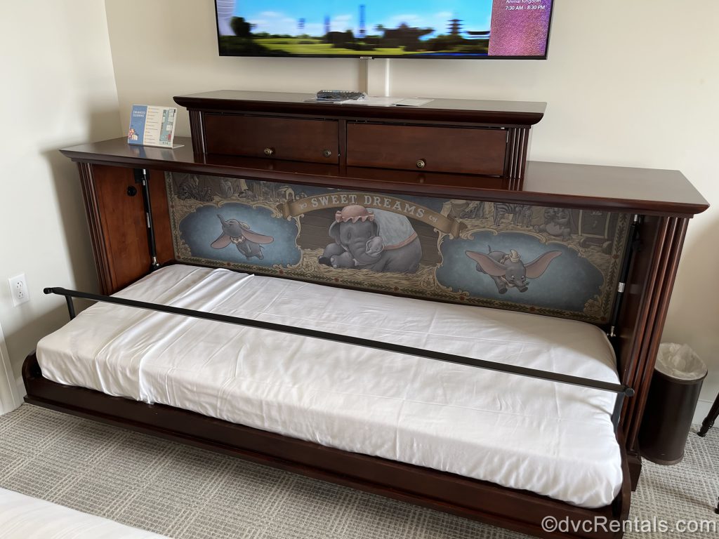 Dumbo Picture behind the pull-down bunk-size bed in a Deluxe studio at the Villas at Disney’s Grand Floridian Resort & Spa