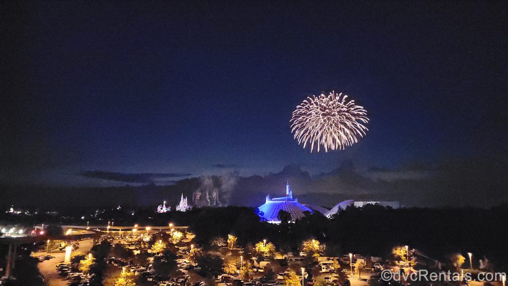 View of Magic Kingdom fireworks seen from the balcony of a theme park view studio at Disney’s Bay Lake Tower