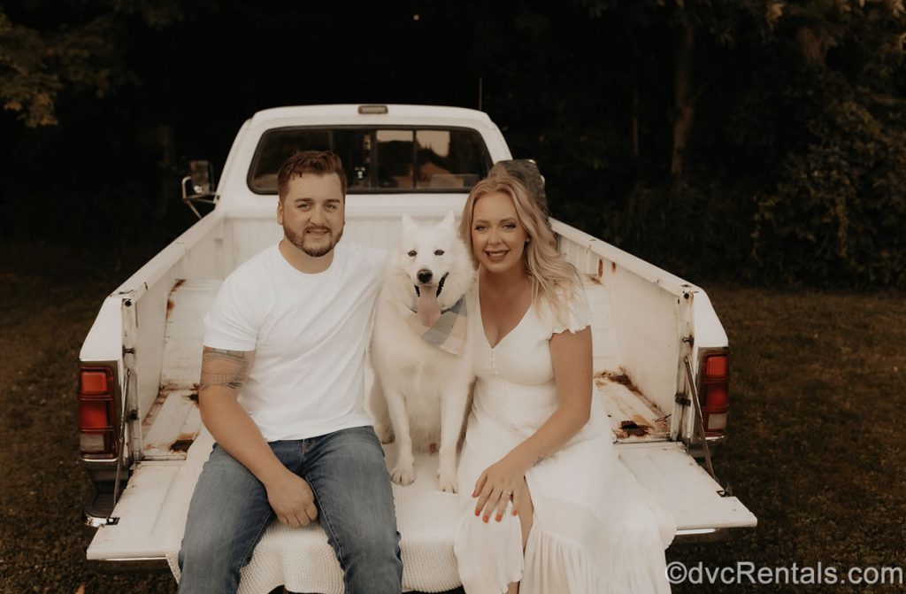 Team Member Maddie with her fiancé and her dog Sherman