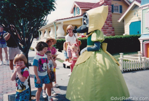 An older photograph showing Meagan as a child meeting one of the mice from Cinderella