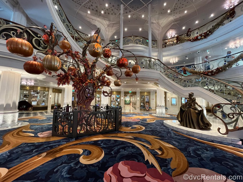A photo of the Grand Hall showing the Pumpkin Tree and the Cinderella statue