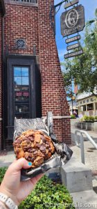 June 2023 Limited Edition cookie in front of the storefront at Gideon’s Bakehouse in Disney Springs