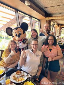Mickey Mouse with team members Elyse, Mya, Allison, Kevin, and Carly