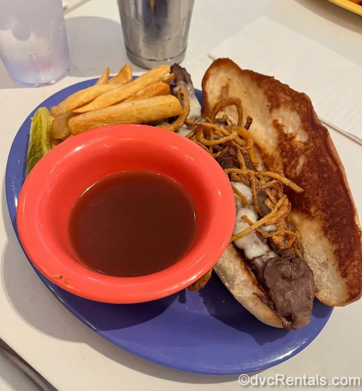 French Dip Sandwich and French Fries on a Blue Plate