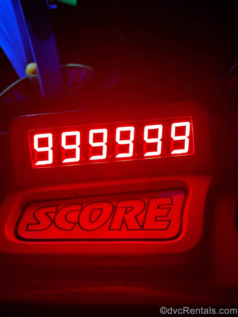 Taycee’s score of 999,999 shining red on the screen of the ride.