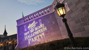 Projection of the words "Mickey's Not So Scary Halloween Party" on the bricks of Cinderella Castle.