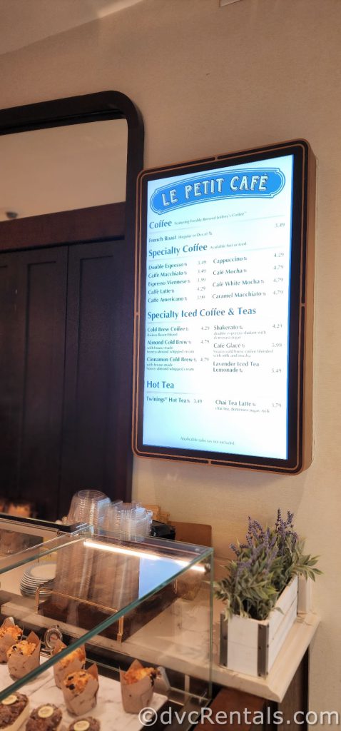 Le Petit Cafe menu board hanging on the wall.