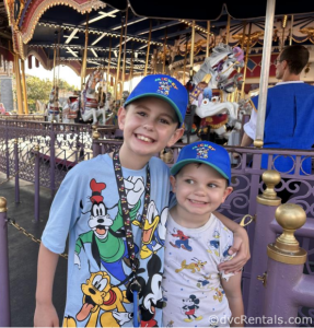Ruth’s two sons, George and Peter, in front of Prince Charming’s Carousel.