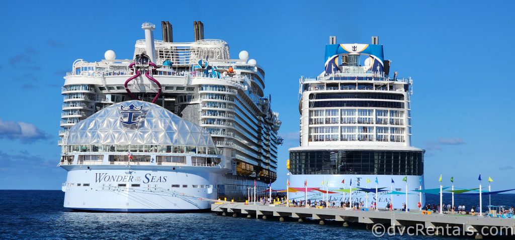 The Wonder of the Seas and the Anthem of the Seas docked in the ocean.