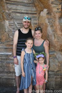 Stephanie, her husband, and her daughters in Walt Disney World.