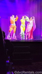 Performers on stage in the Mamma Mia show.