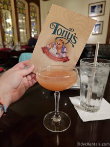 Tony's Town Square Restaurant is being held behind a cocktail.