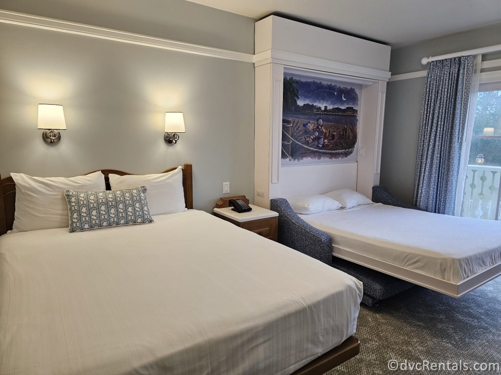 Inside the Studio at Disney's Beach Club Villas. Two queen-sized beds sit next to each other in the middle of the room.