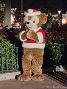 Santa Duffy standing with his hands closed.