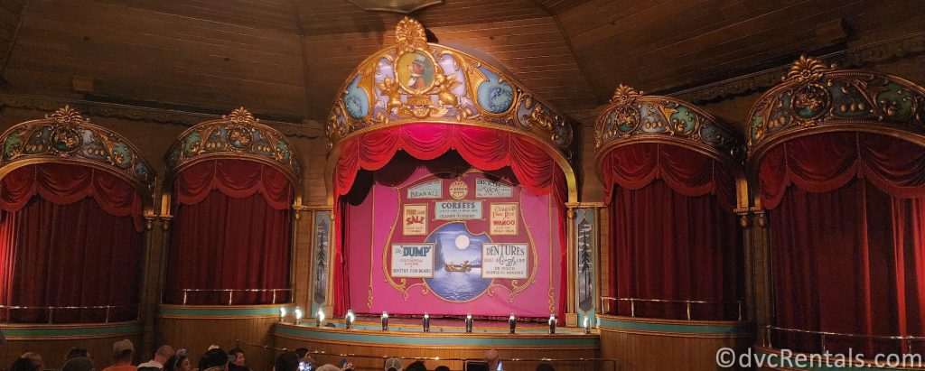 Stage at the Country Bear Jamboree with all of the red curtains closed.