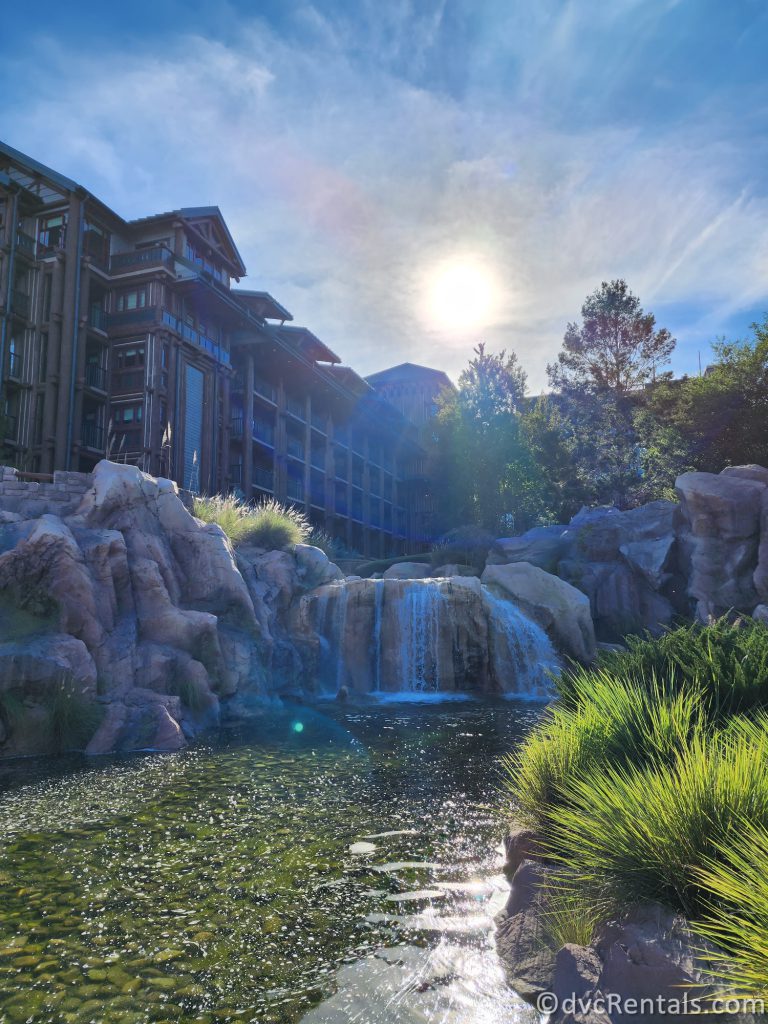 Waterfall with Disney's Wilderness Lodge in the background.