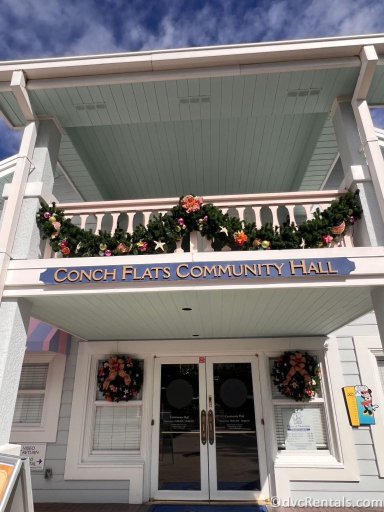 Conch Flats Community Hall with Garland Hanging from the Sign.