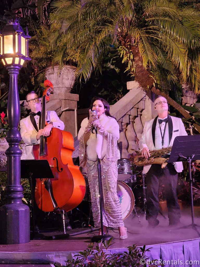 Singer, Double Bass Player, and Saxophone Player form the Tip Top Club Band.