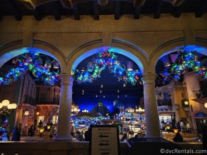 Inside the Mexico Pavilion, with Garland and lights hanging from the building arches.