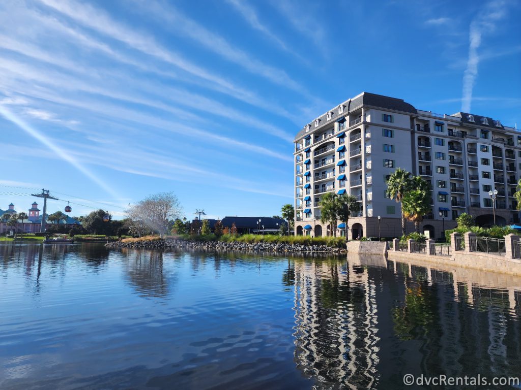 Exterior of Disney's Riviera Resort next to a small body of Water.