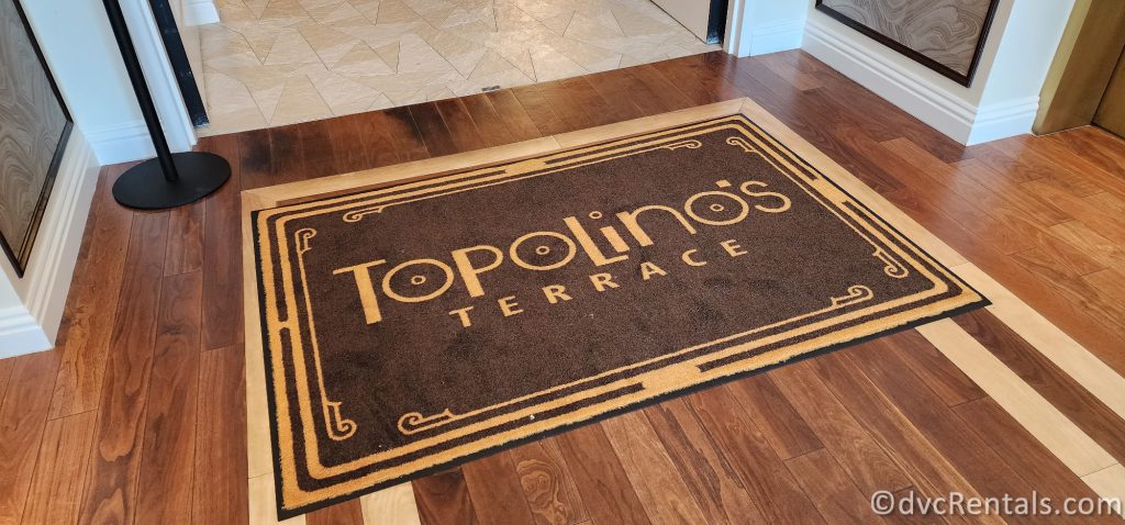 Topolino's Terrace entrance rug with the restaurant name on the brown rug.